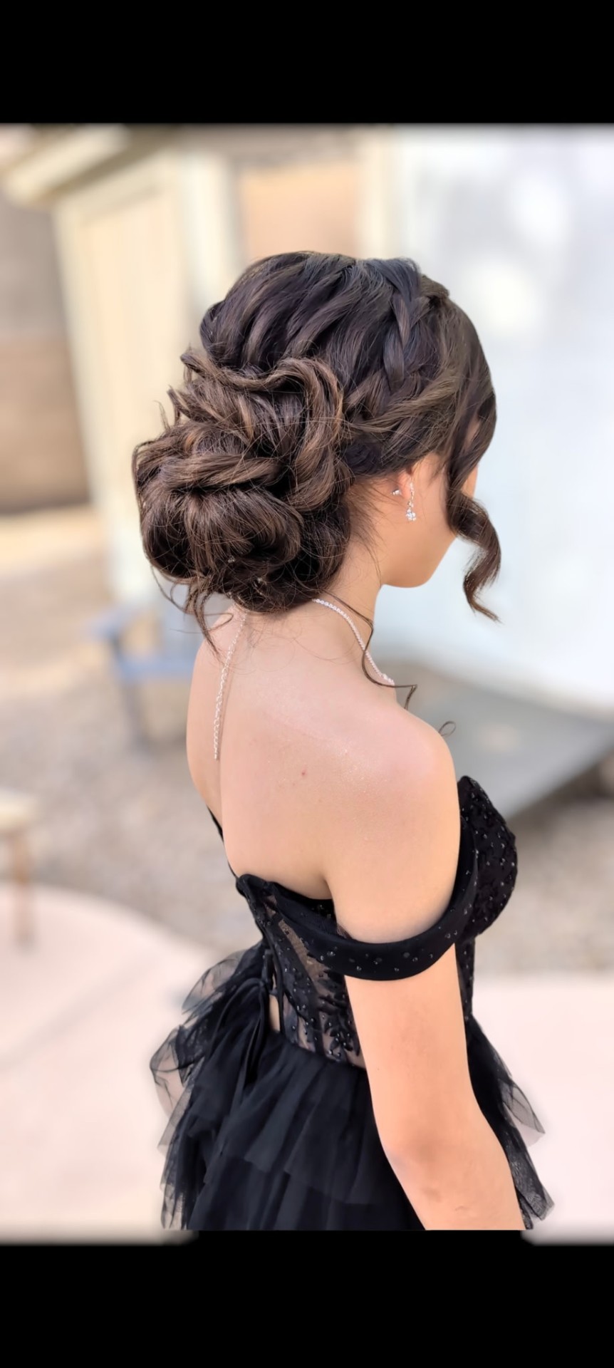 Elegant brunette braided low updo for a special occasion by Hair By Sess