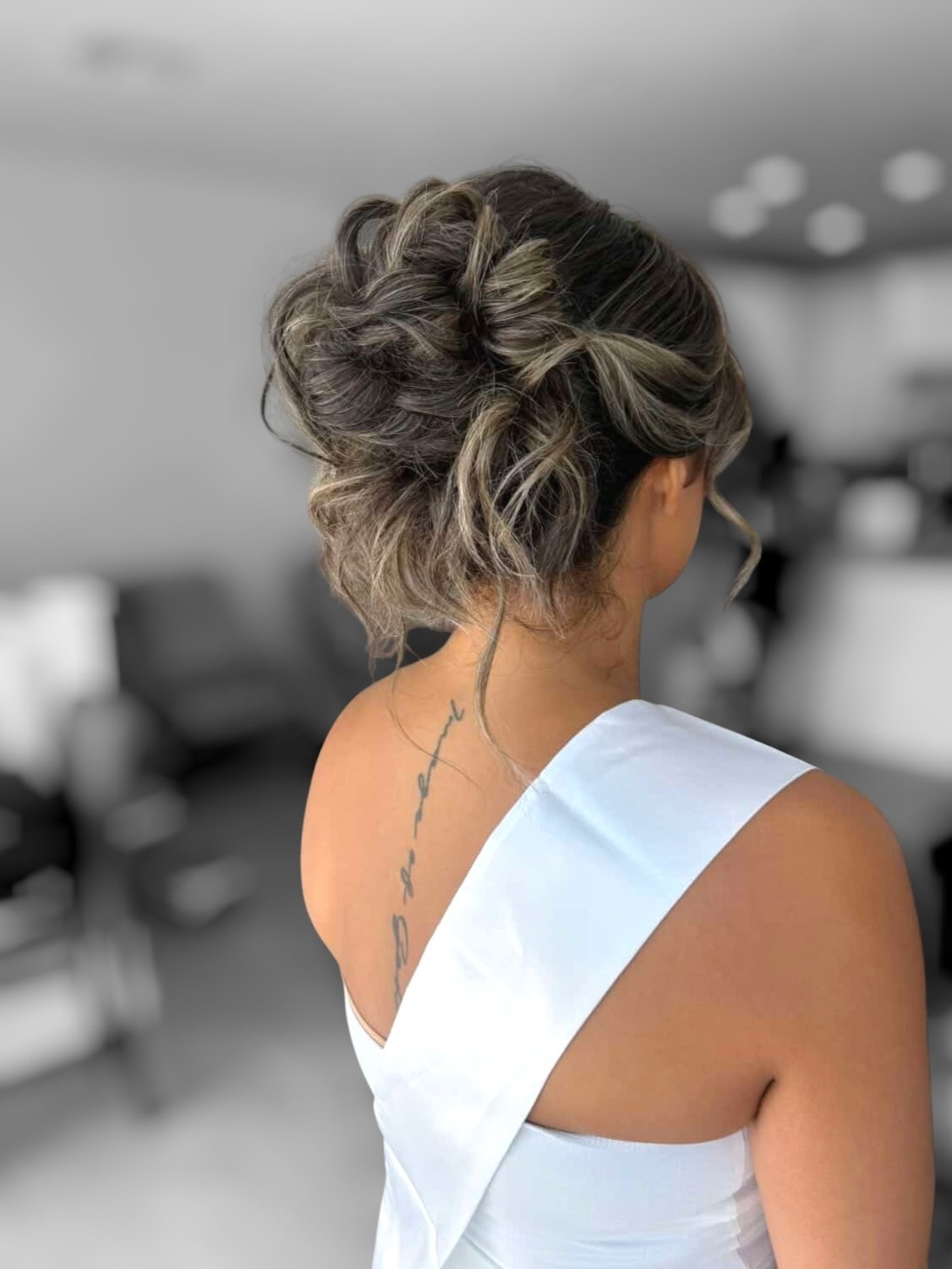 Undone textured updo with highlighted waves by Hair By Sess