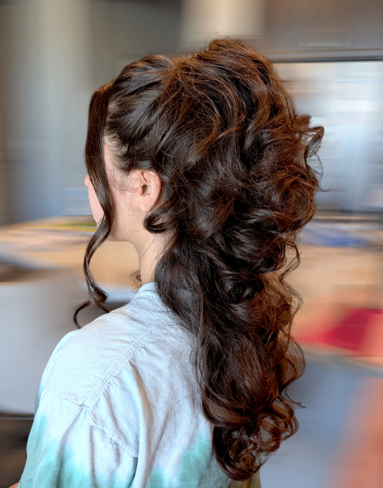 Voluminous brunette half-up hairstyle with cascading curls by Hair By Sess