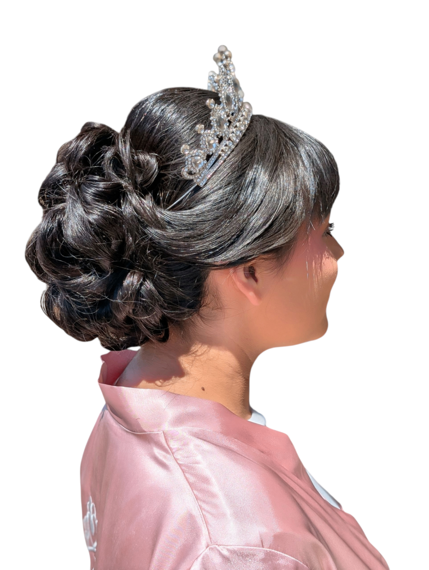 Polished formal updo with a crystal pageant crown by Hair By Sess